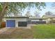 Exterior view of the home showing the blue garage door, blue double doors and gray and white siding at 7780 Osceola St, Westminster, CO 80030