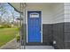 A bright blue front door, modern hardware, and freshly painted with a charming, classic design at 7780 Osceola St, Westminster, CO 80030