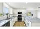 Updated kitchen with new stainless steel appliances, granite countertops and breakfast bar at 7780 Osceola St, Westminster, CO 80030
