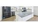 Updated kitchen featuring stainless steel appliances, granite counters, and white cabinetry at 7780 Osceola St, Westminster, CO 80030