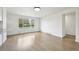Bright and airy living room with a large window, refinished hardwood floors, and a minimalist design at 7780 Osceola St, Westminster, CO 80030