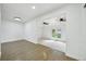 Open-concept living room with hardwood floors and views into another living area at 7780 Osceola St, Westminster, CO 80030