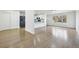 Open-concept living area featuring hardwood floors, a modern kitchen, and abundant natural light at 7780 Osceola St, Westminster, CO 80030
