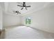 Bright living room with white ceiling, ceiling fans and carpet, with backyard access at 7780 Osceola St, Westminster, CO 80030