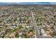 Wide aerial view showcases the home's location in a sprawling suburban community with picturesque streets and lush greenery at 7780 Osceola St, Westminster, CO 80030
