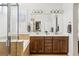 The main bathroom features a shower, soaking tub, double sink vanity and closet at 376 Dallas St, Denver, CO 80230