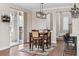 Bright dining room featuring a modern light fixture and sliding glass doors at 376 Dallas St, Denver, CO 80230