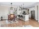 Bright, open kitchen featuring white cabinets and stainless steel appliances at 376 Dallas St, Denver, CO 80230