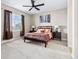 Serene main bedroom with neutral tones, a ceiling fan, and ample natural light at 376 Dallas St, Denver, CO 80230