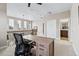 Second floor home office with office furniture and view of an adjacent bathroom at 376 Dallas St, Denver, CO 80230