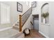 Carpeted staircase with wood railing leads up to the second floor of the house at 376 Dallas St, Denver, CO 80230