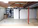 Spacious unfinished basement with high ceilings, storage shelving, and lots of natural light at 1104 Rumbling Sky Pl, Castle Rock, CO 80108