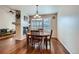 Cozy dining area featuring hardwood floors and modern lighting at 1104 Rumbling Sky Pl, Castle Rock, CO 80108