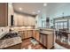 Open-concept kitchen with stainless steel appliances and granite countertops at 1104 Rumbling Sky Pl, Castle Rock, CO 80108