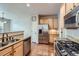 Bright kitchen with granite countertops, stainless steel appliances, and wooden cabinets at 1104 Rumbling Sky Pl, Castle Rock, CO 80108