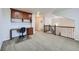 Upstairs living area featuring built-in desk and a staircase with wrought iron railings at 1104 Rumbling Sky Pl, Castle Rock, CO 80108