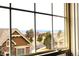 View from a window showcasing a neighborhood and distant mountains, blending comfort with scenic charm at 1104 Rumbling Sky Pl, Castle Rock, CO 80108