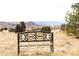 Bench with panoramic views of mountains and community at 1104 Rumbling Sky Pl, Castle Rock, CO 80108