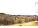 Scenic view of rolling hills and homesites from behind a rustic wooden fence at 1104 Rumbling Sky Pl, Castle Rock, CO 80108
