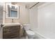 This bathroom has an espresso vanity, toilet, and shower over tub with white subway tile at 6495 E Happy Canyon Rd # 158, Denver, CO 80237