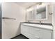 Modern bathroom with a double vanity, sleek mirrors, contemporary finishes, and stylish floors at 6495 E Happy Canyon Rd # 158, Denver, CO 80237