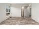 Comfortable bedroom featuring stylish floors, a window with a view, and a walk-in closet at 6495 E Happy Canyon Rd # 158, Denver, CO 80237