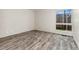A spacious bedroom with stylish floors, a window with a view, and ample natural light at 6495 E Happy Canyon Rd # 158, Denver, CO 80237