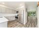 Modern kitchen with stainless steel appliances, sleek countertops, and a view of the living area at 6495 E Happy Canyon Rd # 158, Denver, CO 80237