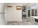 An additional space in the kitchen shows stainless steel appliances and stacked washer/dryer at 6495 E Happy Canyon Rd # 158, Denver, CO 80237