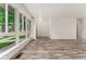 Well-lit living room with large windows and sleek flooring, perfect for modern living at 6495 E Happy Canyon Rd # 158, Denver, CO 80237