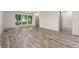 Bright living room with expansive windows offering natural light, complemented by sleek flooring at 6495 E Happy Canyon Rd # 158, Denver, CO 80237