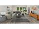 Comfortable living room with a large sectional sofa, modern decor, and natural light streaming through large windows at 6495 E Happy Canyon Rd # 158, Denver, CO 80237