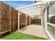 This fenced patio features a pergola, providing shade and privacy, enhancing the outdoor living space at 6495 E Happy Canyon Rd # 158, Denver, CO 80237