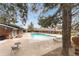 The community pool is surrounded by lounge chairs, providing a relaxing outdoor space at 6495 E Happy Canyon Rd # 158, Denver, CO 80237