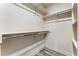 Walk-in closet with stylish floors, built-in shelving, and ample storage space at 6495 E Happy Canyon Rd # 158, Denver, CO 80237