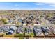 This aerial view shows the home's setting in a residential area, highlighting its backyard and surrounding landscape at 8827 Cloverleaf Cir, Parker, CO 80134