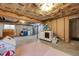 Unfinished basement area with mechanicals, laundry machines, shelving and a pink rug at 8827 Cloverleaf Cir, Parker, CO 80134