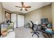 Bright bedroom with office setup and lots of natural light, closet, and plant decor at 8827 Cloverleaf Cir, Parker, CO 80134