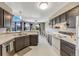 Kitchen featuring modern appliances, generous counter space, and breakfast nook with backyard view at 8827 Cloverleaf Cir, Parker, CO 80134