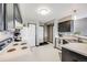 Kitchen featuring generous counter space, modern appliances, and access to multiple entryways at 8827 Cloverleaf Cir, Parker, CO 80134