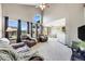 Bright living room with vaulted ceilings, large windows and an open floor plan at 8827 Cloverleaf Cir, Parker, CO 80134