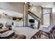 Spacious living room featuring vaulted ceilings, a staircase, and an open layout at 8827 Cloverleaf Cir, Parker, CO 80134