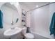 Clean bathroom with a bathtub, toilet, and pedestal sink at 16130 E 111Th Dr, Commerce City, CO 80022