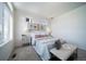 Spacious bedroom with large windows, plush bedding and window seating at 16130 E 111Th Dr, Commerce City, CO 80022
