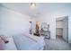 Main bedroom with ensuite bath, walk-in closet, and sitting area at 16130 E 111Th Dr, Commerce City, CO 80022
