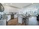 Open concept kitchen with island, stainless steel appliances, and granite countertops at 16130 E 111Th Dr, Commerce City, CO 80022