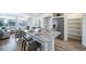 Kitchen features granite island, stainless steel refrigerator, and ample shelving at 16130 E 111Th Dr, Commerce City, CO 80022