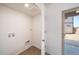 Laundry room with exterior access and built-in shelving at 16130 E 111Th Dr, Commerce City, CO 80022