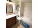 Cozy bathroom with a white tub, framed mirror, and decorative plants adding a fresh touch at 7883 S Kalispell Cir, Englewood, CO 80112