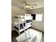 Playful bedroom featuring a bunk bed, fun carpet, and ceiling fan for a cozy and imaginative space at 7883 S Kalispell Cir, Englewood, CO 80112